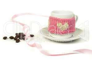 cup of coffee with knitted heart symbol