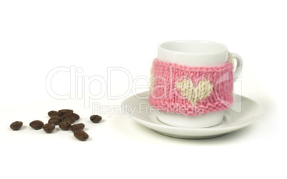 cup of coffee with knitted heart symbol