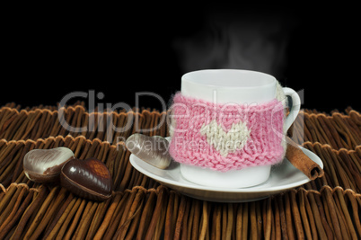 cup of coffee with knitted heart symbol