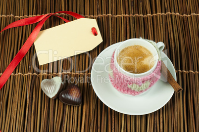 cup of coffee with knitted heart symbol