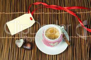 cup of coffee with knitted heart symbol