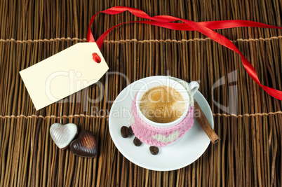 cup of coffee with knitted heart symbol