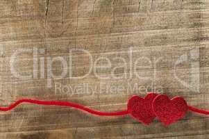 red ribbon tape and two hearts