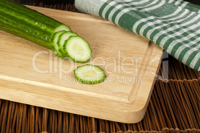 sliced ??cucumber on a wooden board