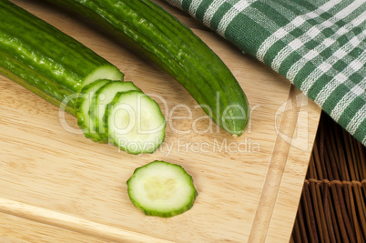 sliced ??cucumber on a wooden board