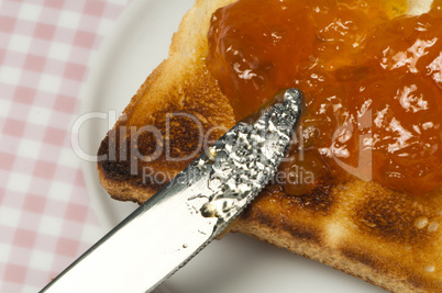 spread jam on bread