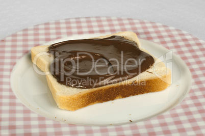 liquid chocolate on a slice of bread