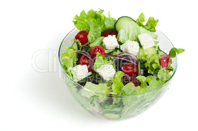 salad in a glass bowl on a white background
