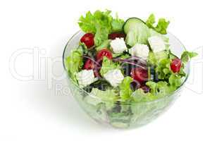 salad in a glass bowl on a white background