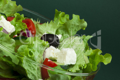 salad in a glass bowl close up.