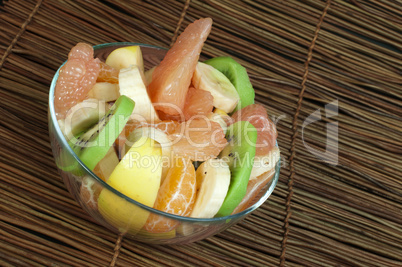 fruit salad with citrus in a glass bowl