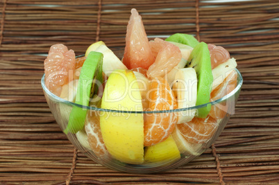 fruit salad with citrus in a glass bowl