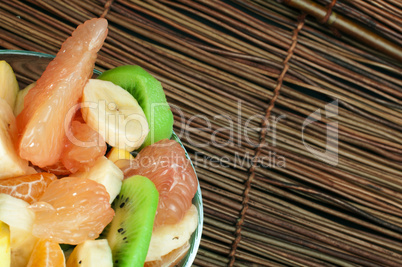 fruit salad with citrus in a glass bowl