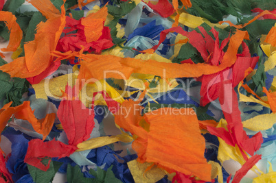 many colorful pieces of torn paper