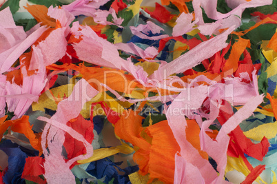 many colorful pieces of torn paper