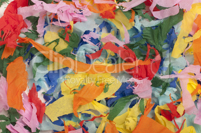 many colorful pieces of torn paper