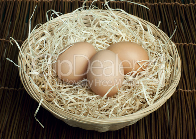 raw eggs in a wicker basket