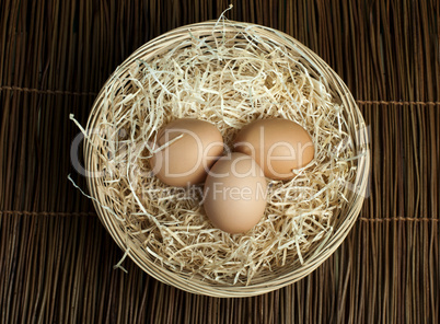 raw eggs in a wicker basket