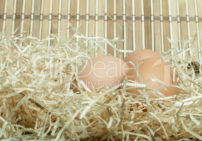 raw eggs in straw