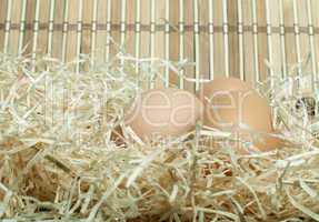 raw eggs in straw