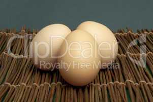 raw eggs on wooden base