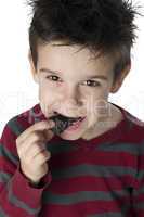 smiling kid eating chocolate