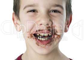 smiling little boy eating chocolate
