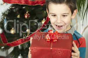 happy child receive the gift of christmas