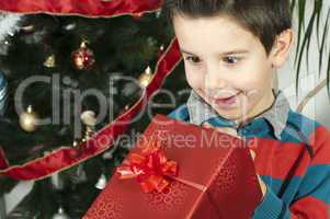 happy child receive the gift of christmas
