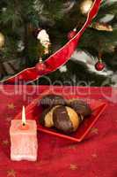 christmas sweets and candle on the table