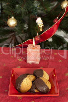 christmas sweets and candle on the table