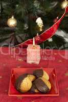 christmas sweets and candle on the table