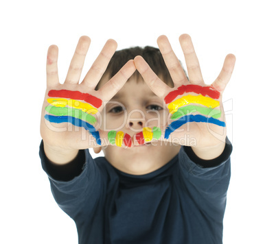 boy hands painted with colorful paint