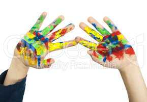 boy hands painted with colorful paint