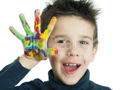 boy hands painted with colorful paint