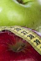 red and green apple and centimeter
