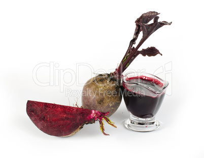 red beets with leaves, slice beets and jug with juice