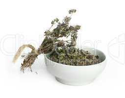 dried thyme in a bowl and thyme twigs