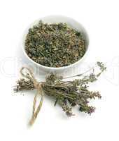 dried thyme in a bowl and thyme twigs