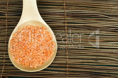 lentil split in wooden spoon