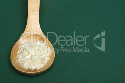 basmati rice in wooden spoon