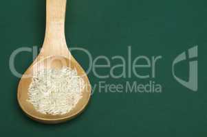 basmati rice in wooden spoon