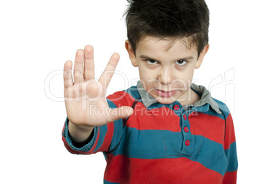 little boy showing stop with his hand