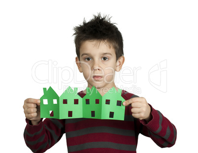 little boy holding houses made ??of paper