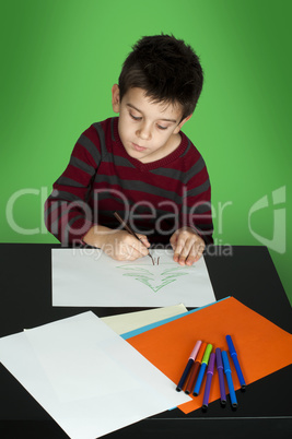 boy drawing with markers