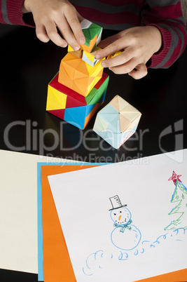 boy playing with multicolored cubes