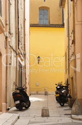 scooters parked at the old buildings.