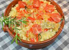 Couscous with vegetables in clay dish