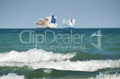 commercial container ship on blue sky