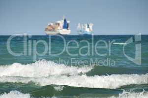 commercial container ship on blue sky